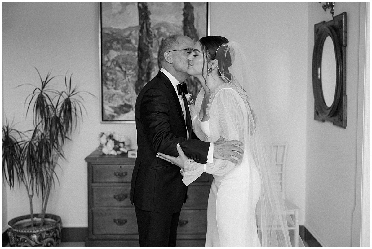 bride first look with father