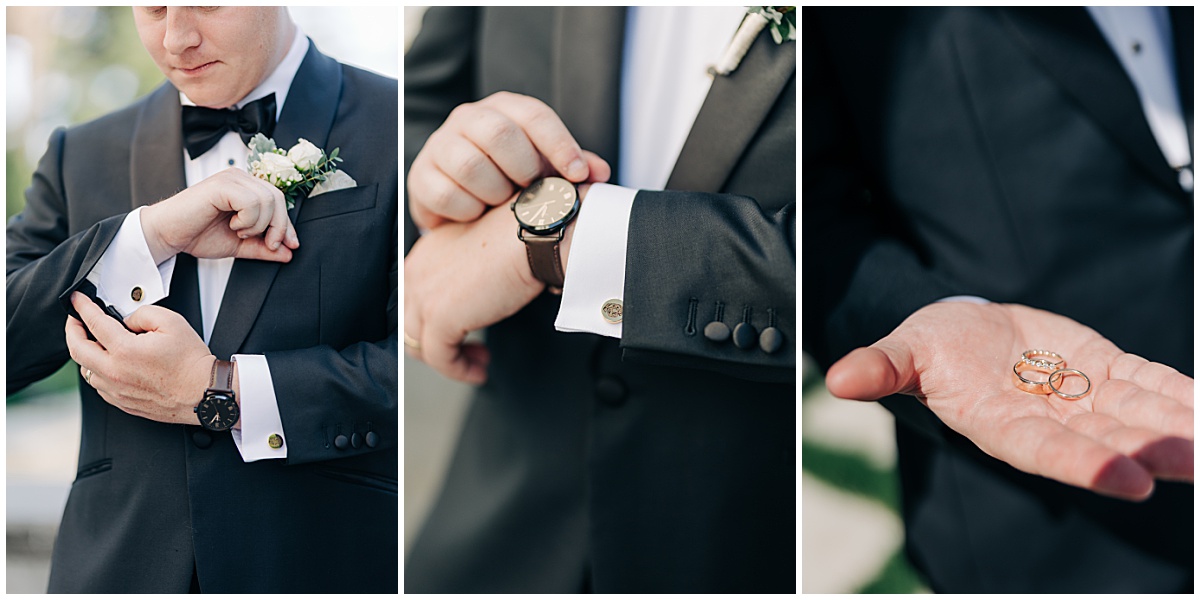 Groom holding rings and buttoning up sleeve