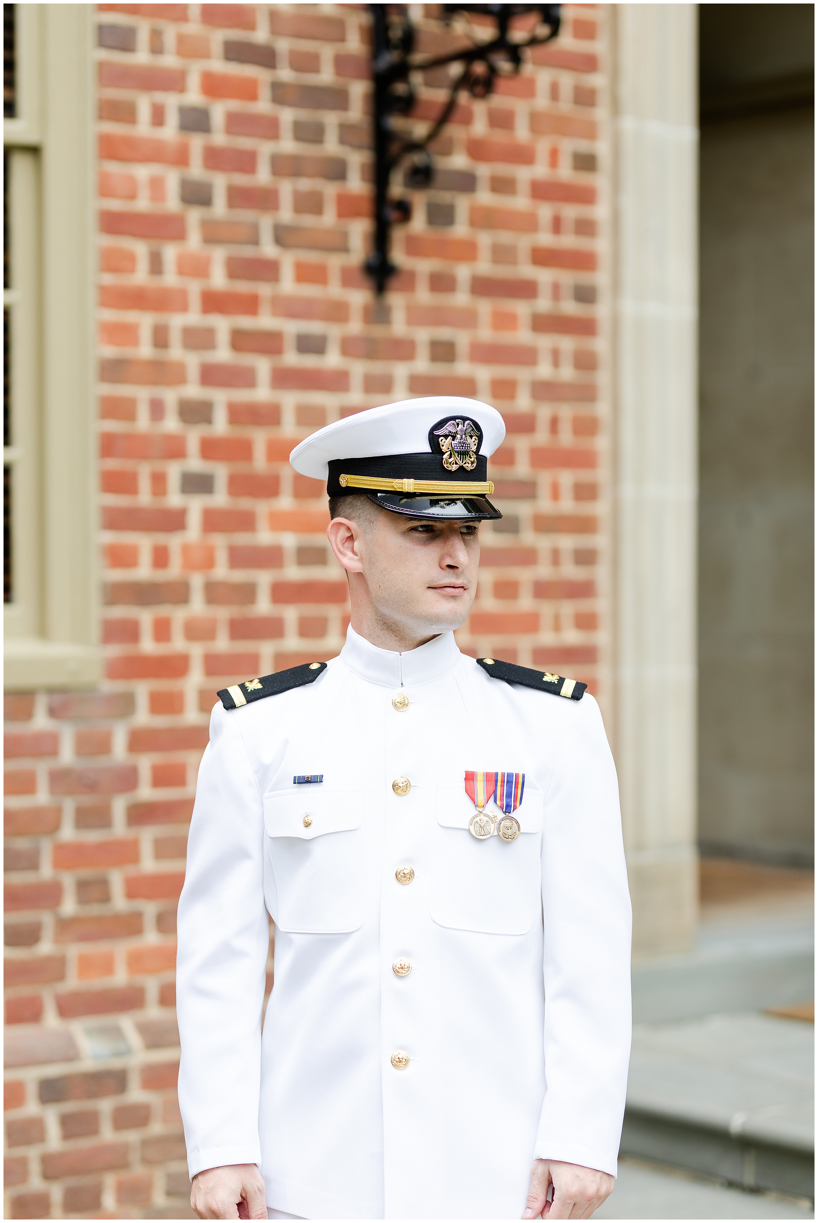 Groom wearing his Navy uniform Luke and Ashley Photography