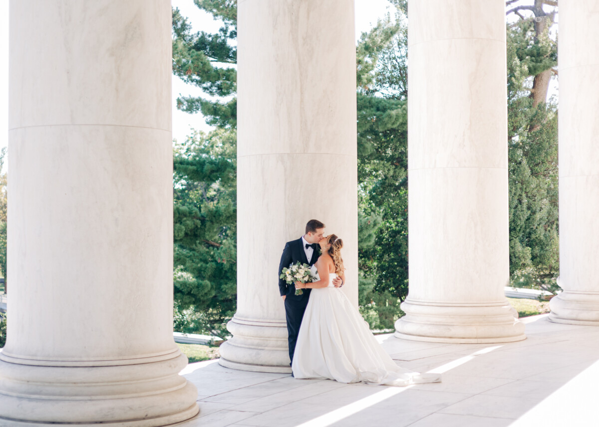 Bride and groom kissing by Luke and Ashley Photography
